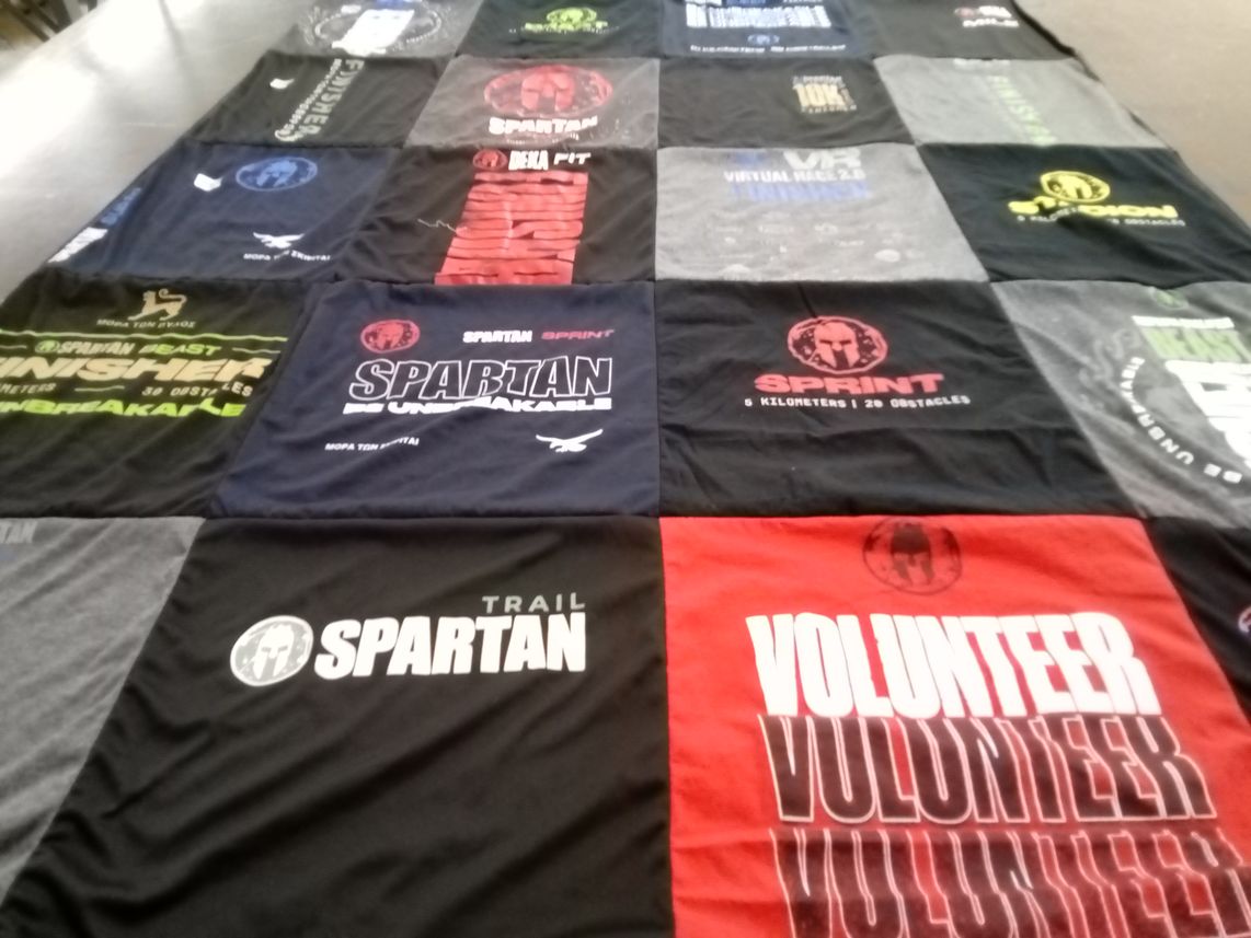 T-shirt quilt with fitness, obstacle course racing themes by Jennifer from TN