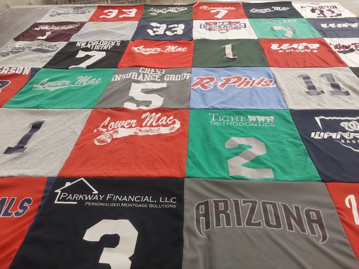 T-shirt quilt with sports, community themes by Colleen from NC
