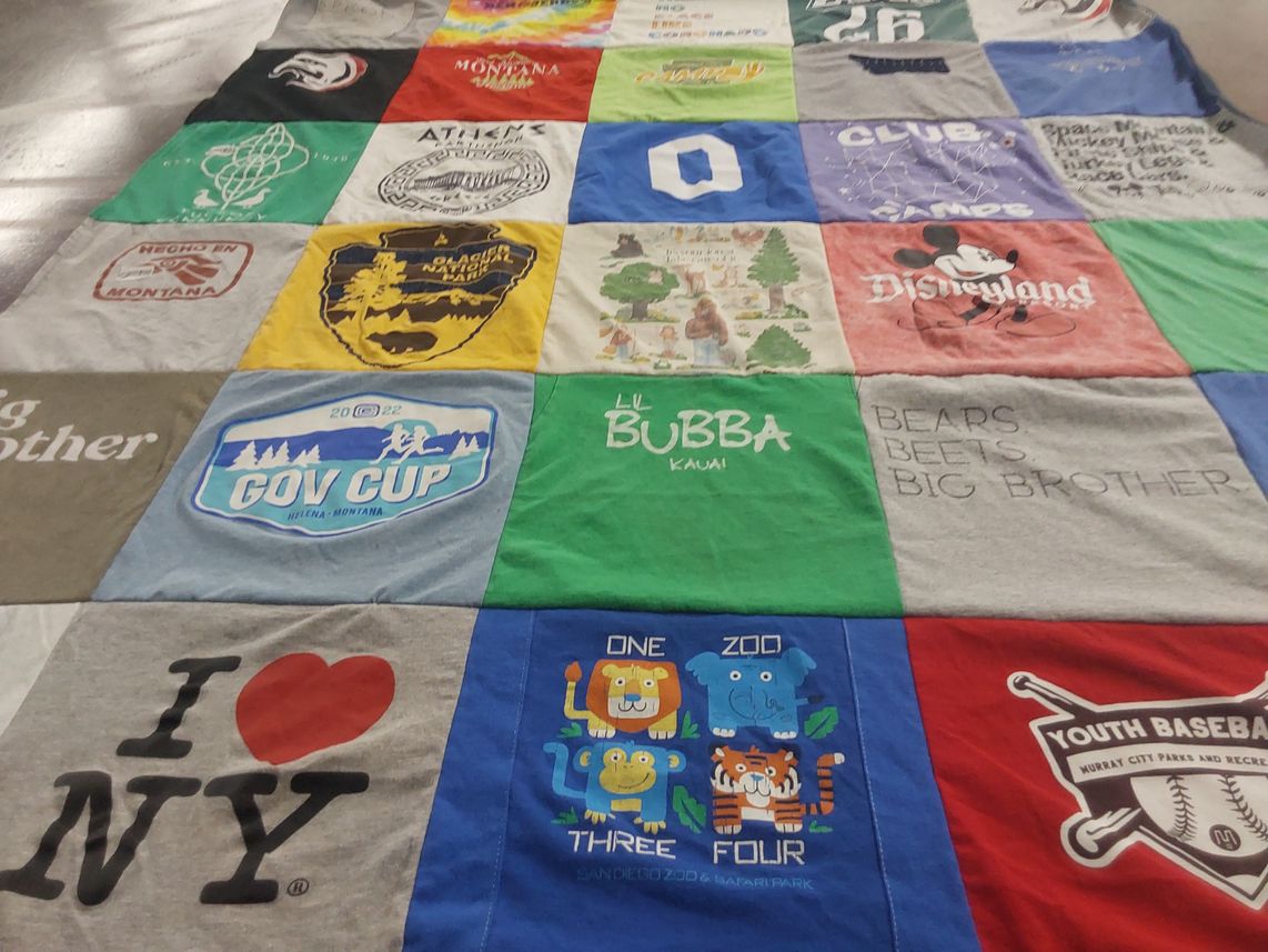 T-shirt quilt with sports, travel themes by krysti from UT