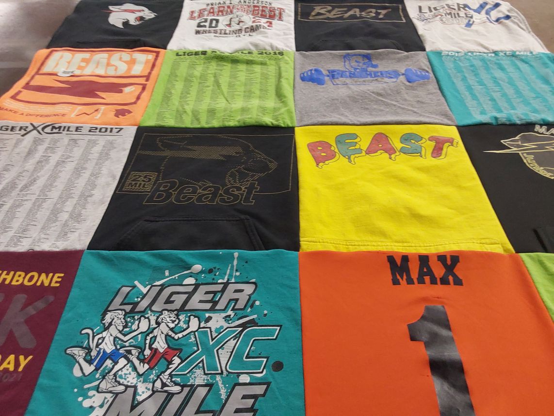 T-shirt quilt with running, sports themes by Kathleen from IN