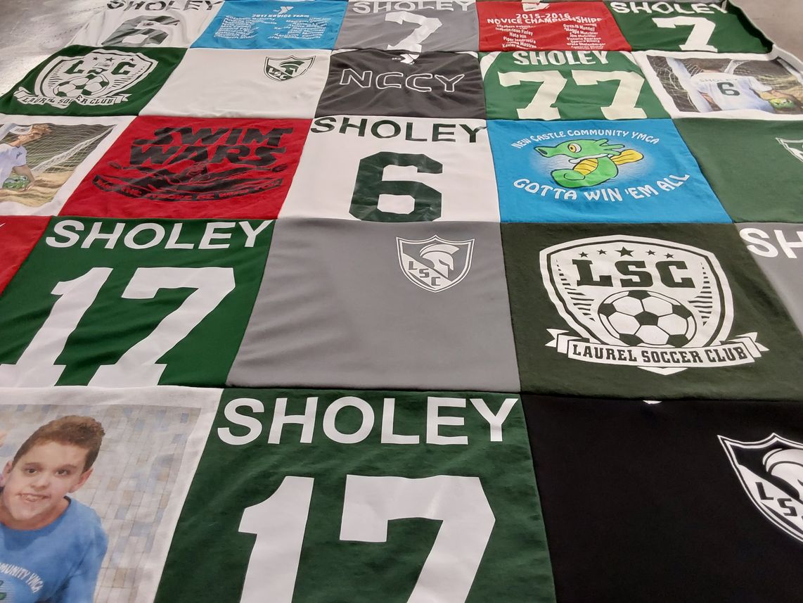 T-shirt quilt with soccer, swimming themes by Kimberly from PA