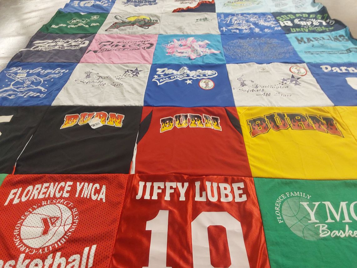 T-shirt quilt with basketball, softball themes by Denise from AL