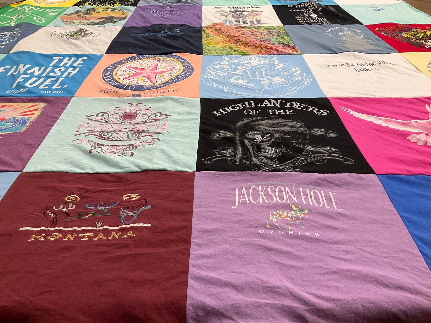 T-shirt quilt with travel, outdoors themes by Nicole from NC