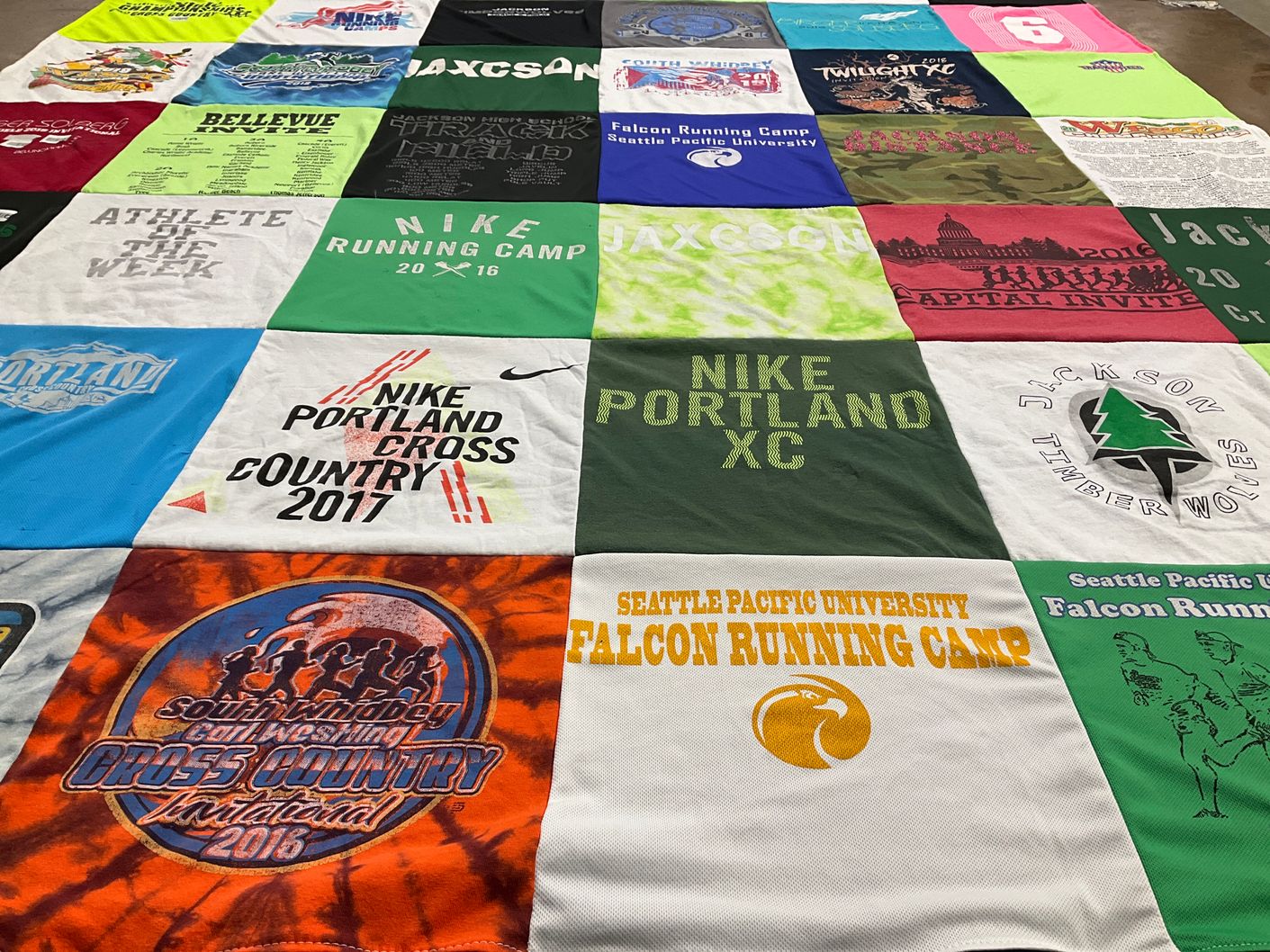 T-shirt quilt featuring jackson cross country team by Oksana from WA