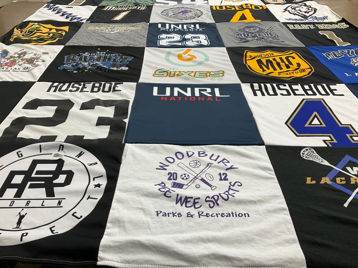 T-shirt quilt with sports, lacrosse themes by Kristine from MN