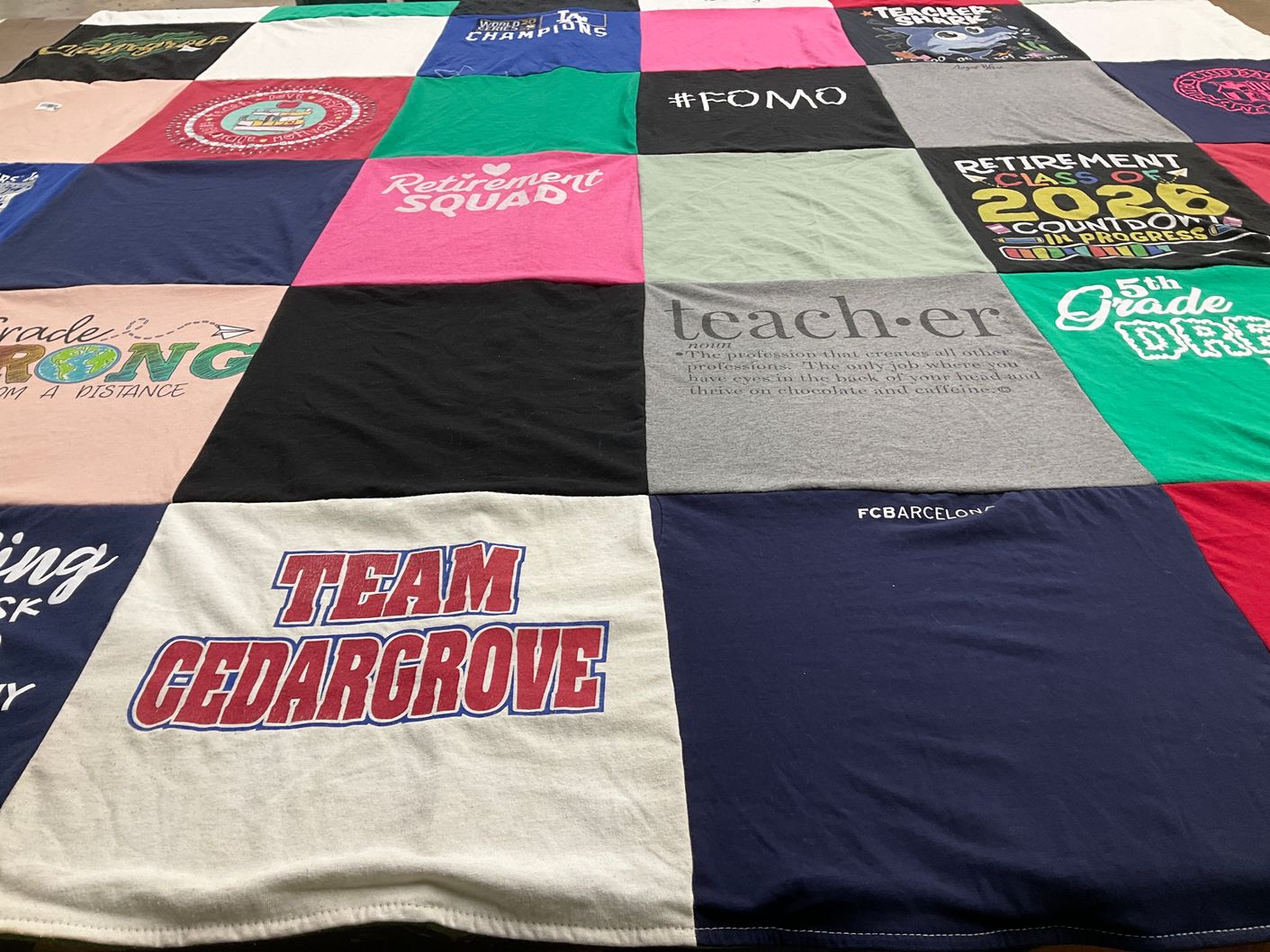 T-shirt quilt with education, retirement themes by Vicky from CA