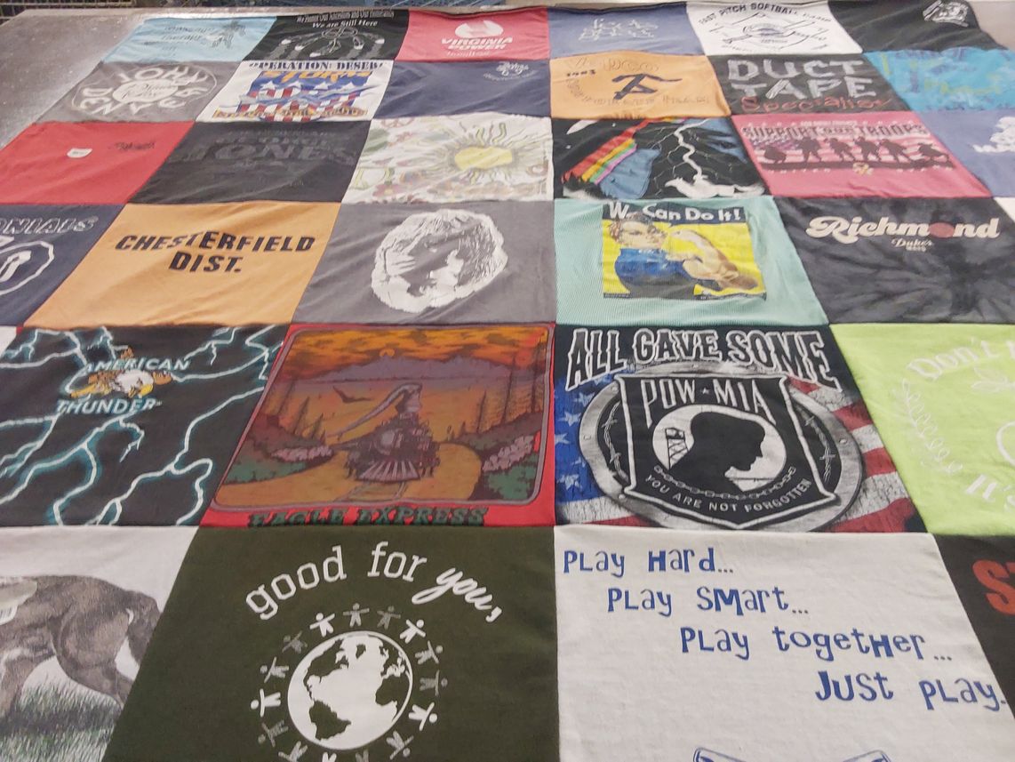 T-shirt quilt with sports, community themes by Mary B from VA