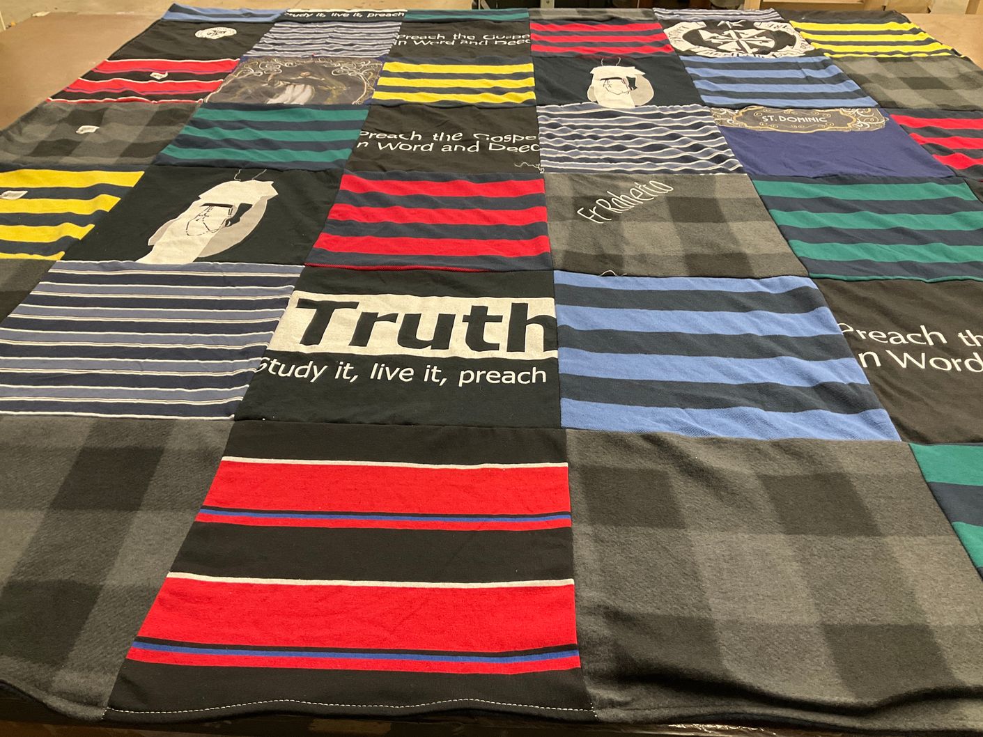 T-shirt quilt with education, religion themes by ROBERTO from LA