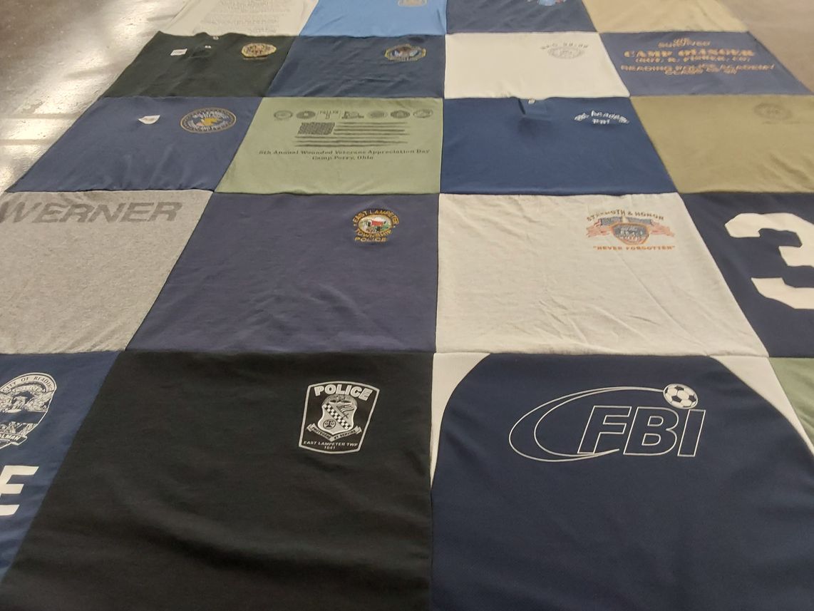 T-shirt quilt with law enforcement, veterans themes by Dara from VA