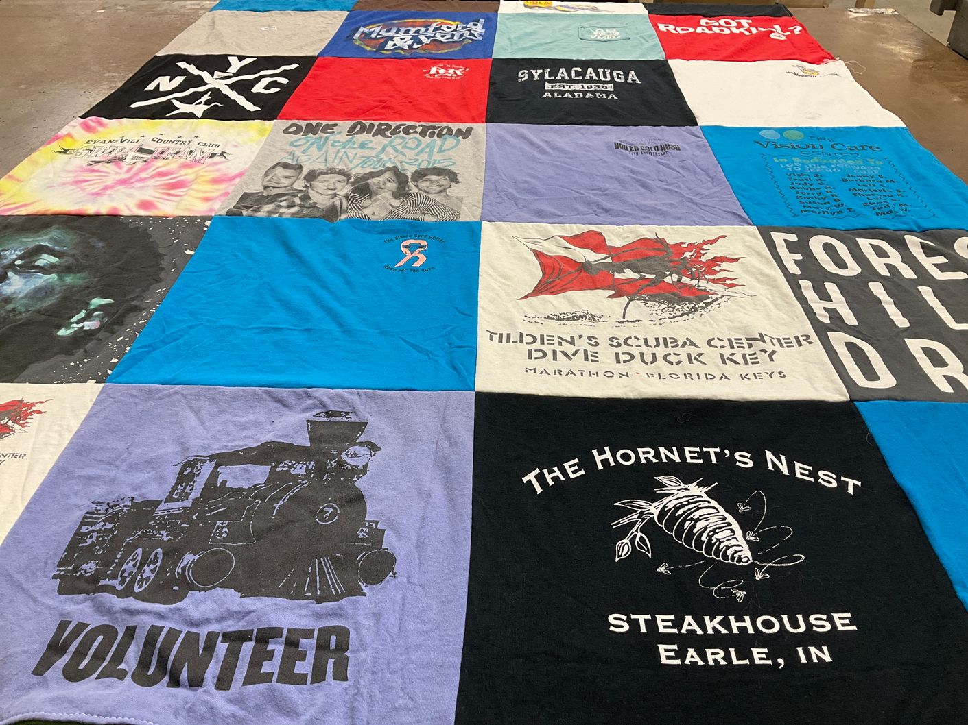T-shirt quilt with music, scuba diving themes by Meg from OR
