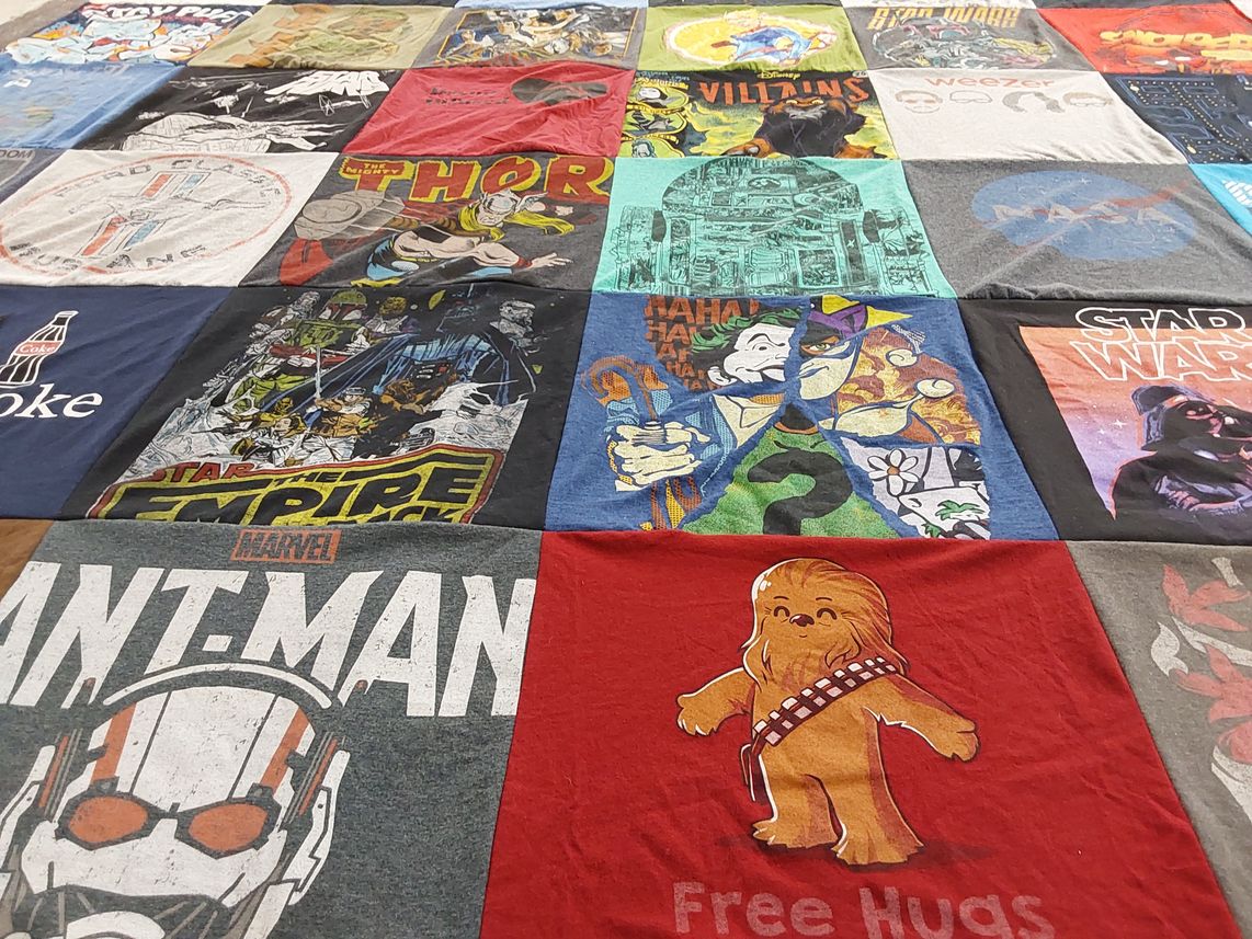 T-shirt quilt with comics, movies themes by Maggie from NC