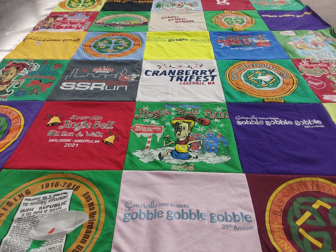 T-shirt quilt with running, festivals themes by Katie from MA