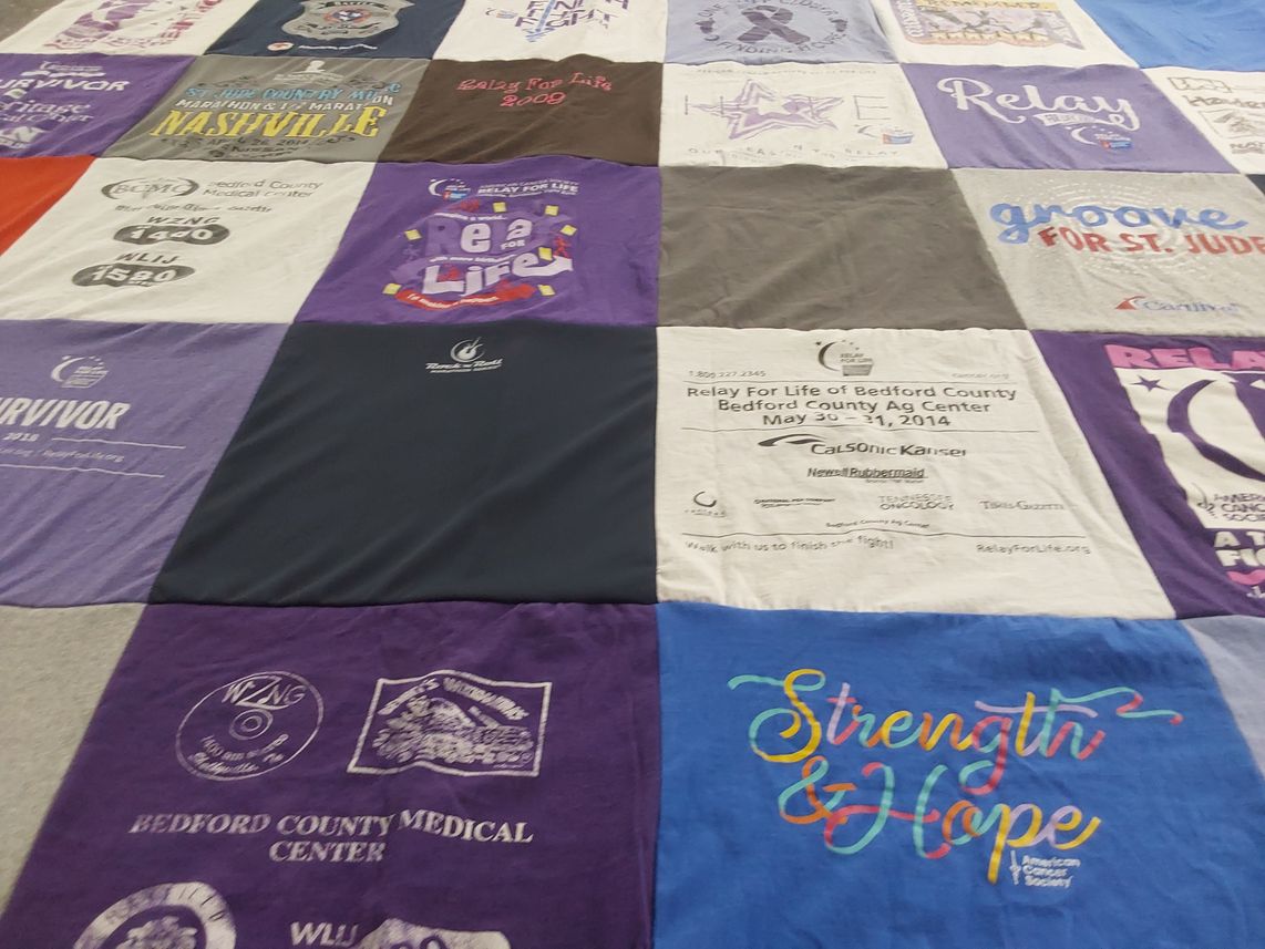 T-shirt quilt with cancer awareness, community support themes by MARY from TN