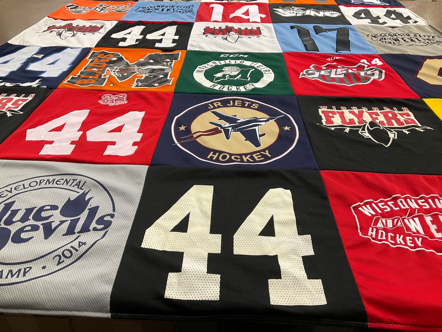 T-shirt quilt with ice hockey themes by Andrea from WI