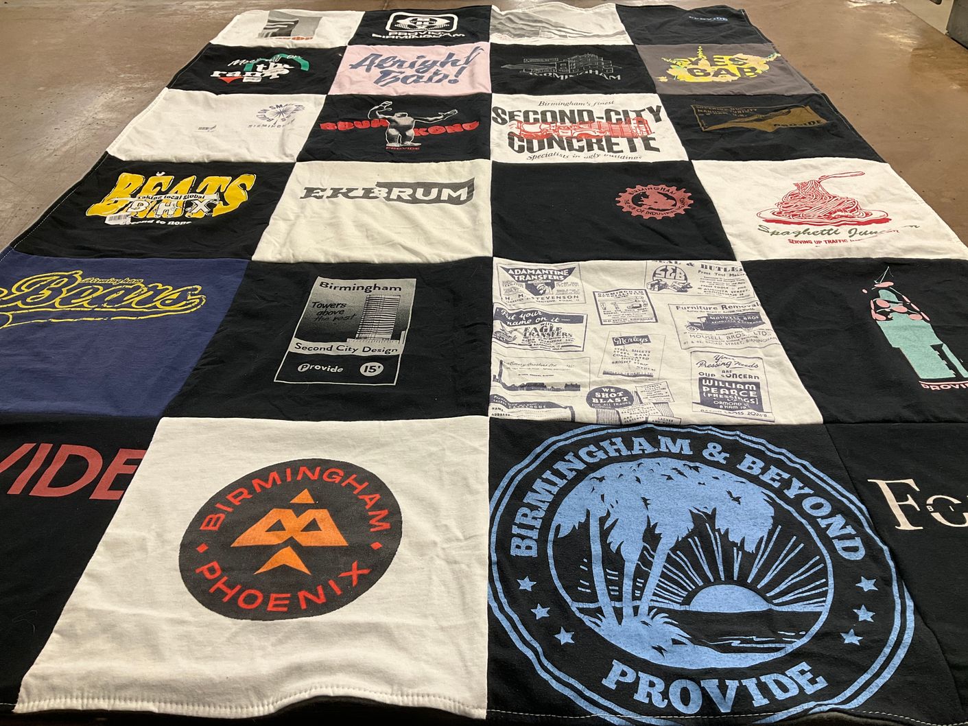 T-shirt quilt with local businesses, food culture themes by DANIEL from NJ