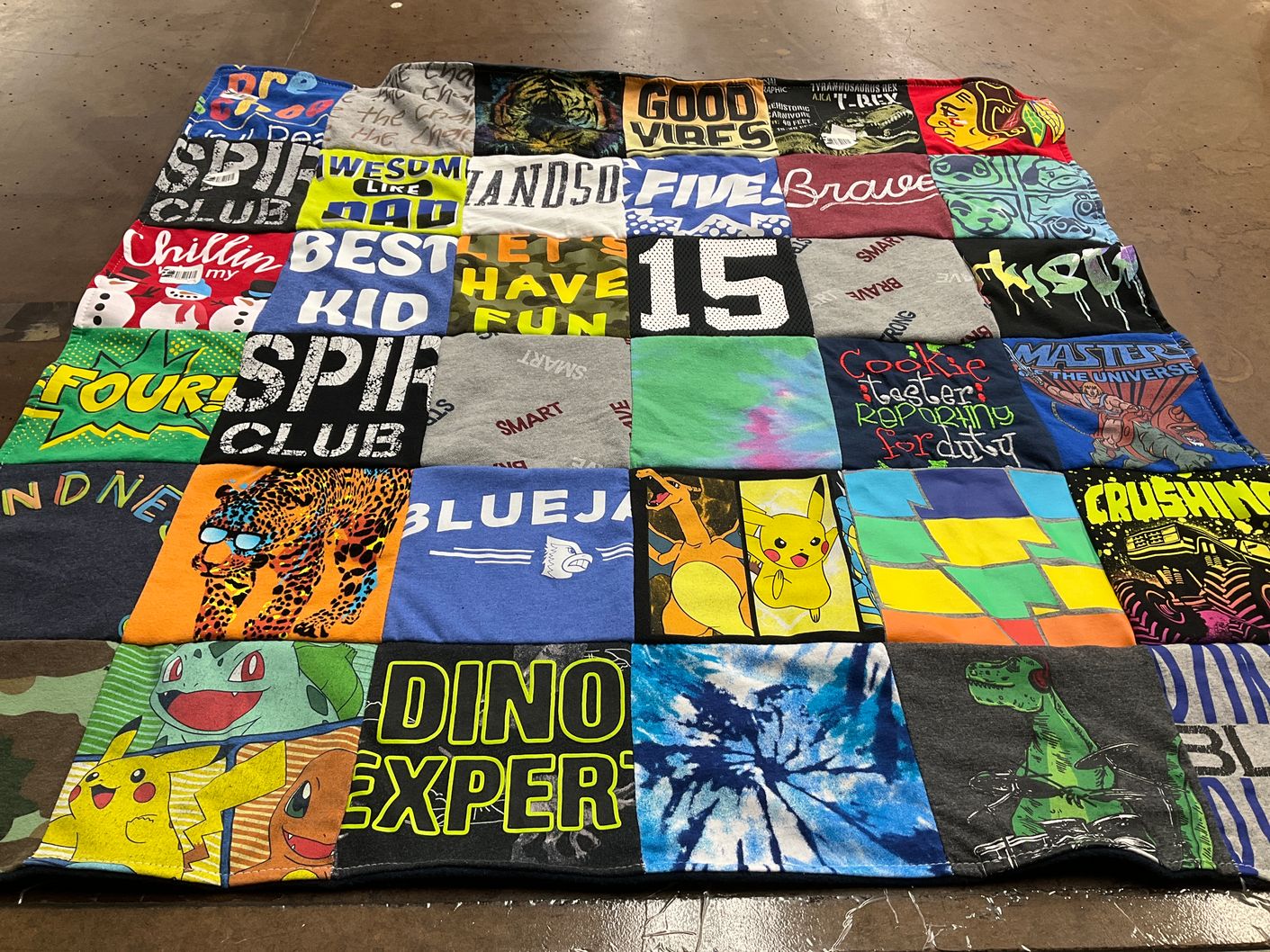 T-shirt quilt with pokemon, superheroes themes by Stephanie from IA