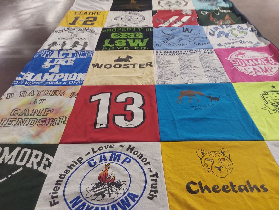 T-shirt quilt with camping, swimming themes by Katherine from VA