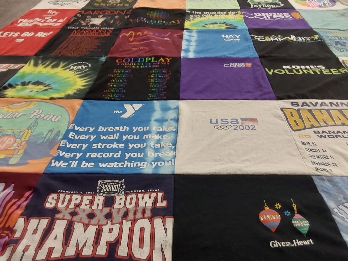 T-shirt quilt with music, sports themes by Nancy from MA