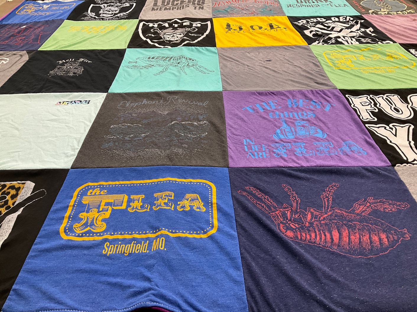 T-shirt quilt with local markets, vintage clothing themes by Lexie from MO
