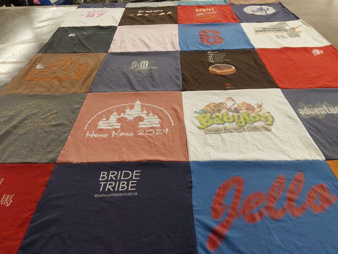 T-shirt quilt with travel, festivals themes by Rachel from CA