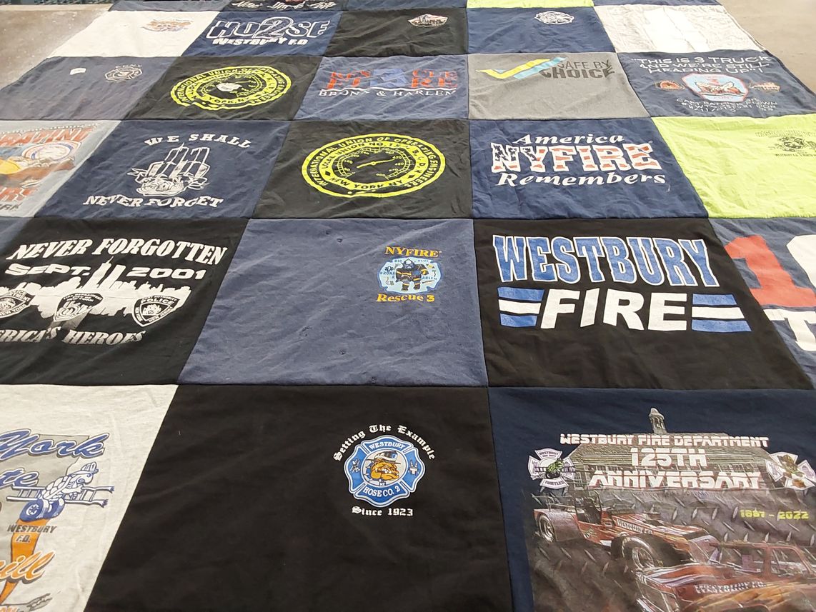 T-shirt quilt with firefighting, community service themes by Christopher from NY