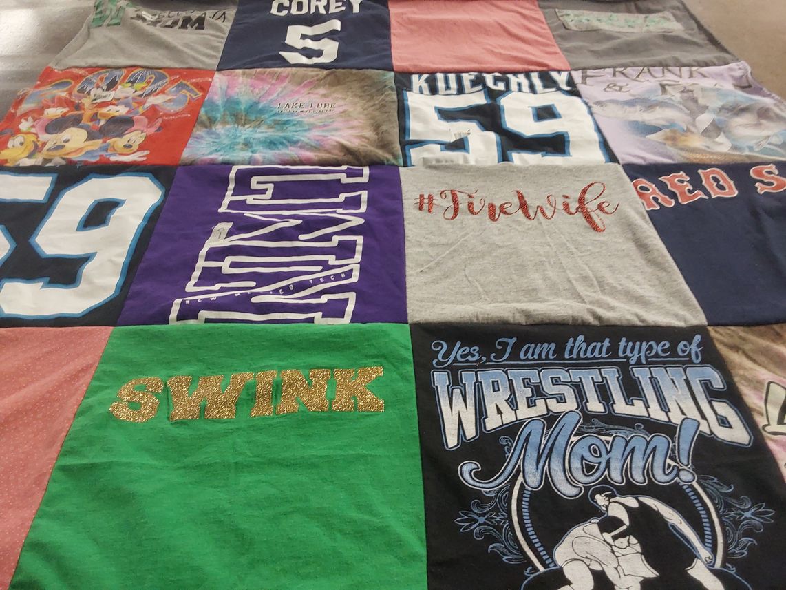 T-shirt quilt with wrestling, family themes by Desaree from NC