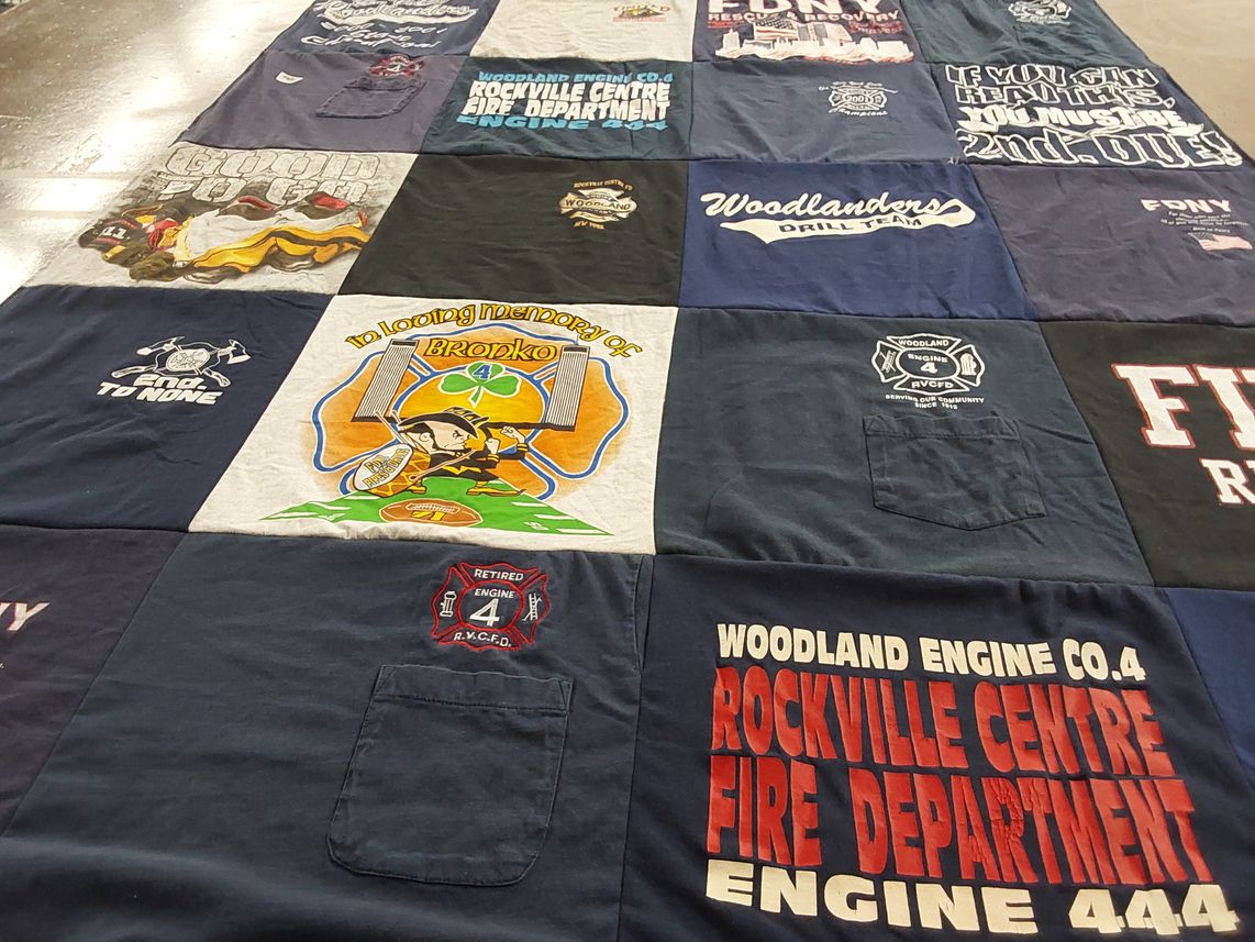 T-shirt quilt with firefighting, community service themes by Kathleen from SC