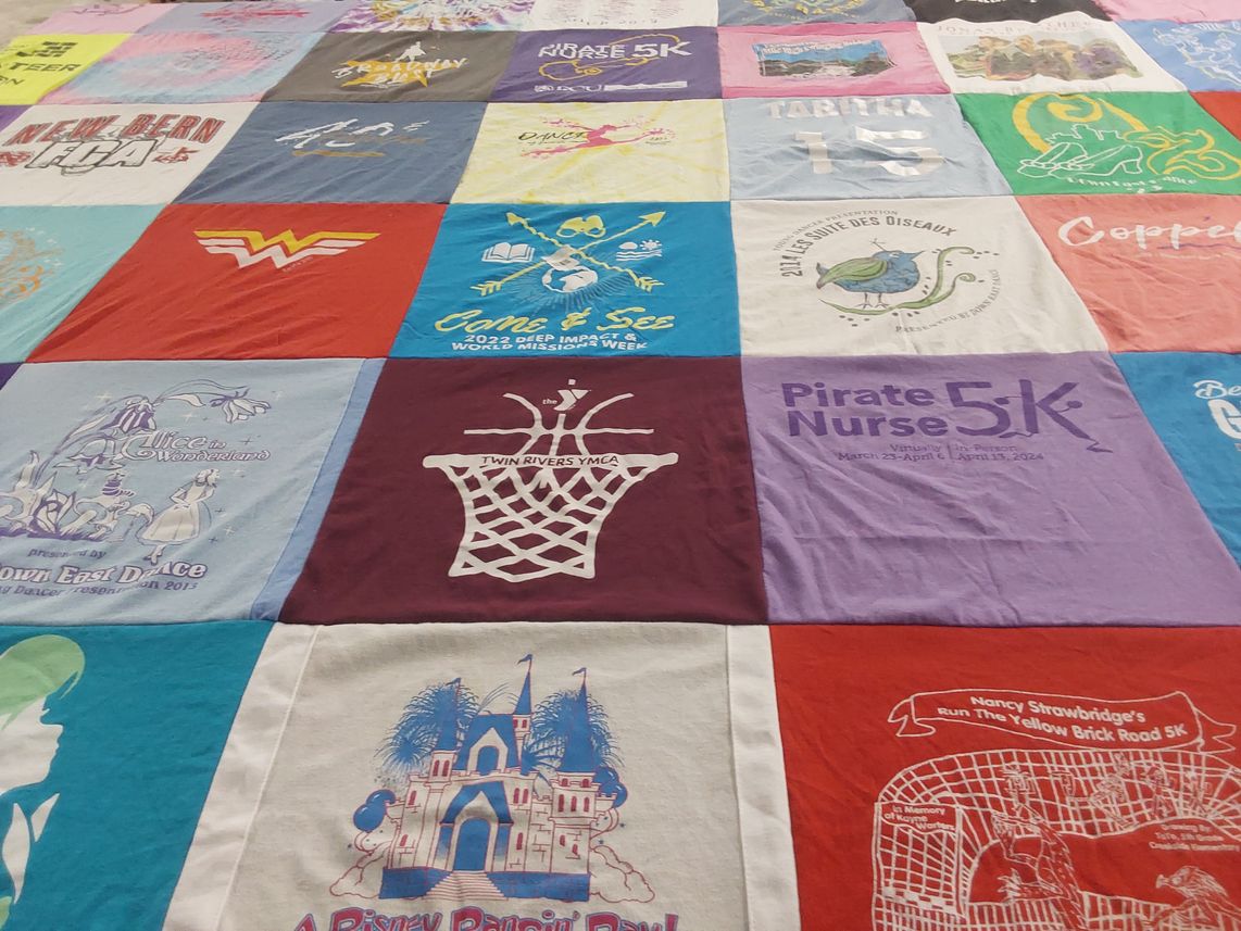 T-shirt quilt with running, dance themes by David from NC