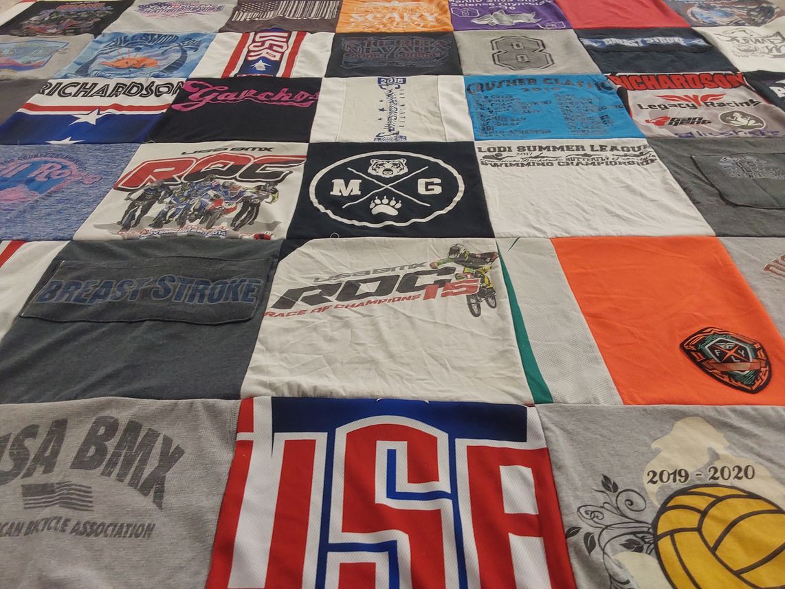 T-shirt quilt with bmx, swimming themes by Christine from CA