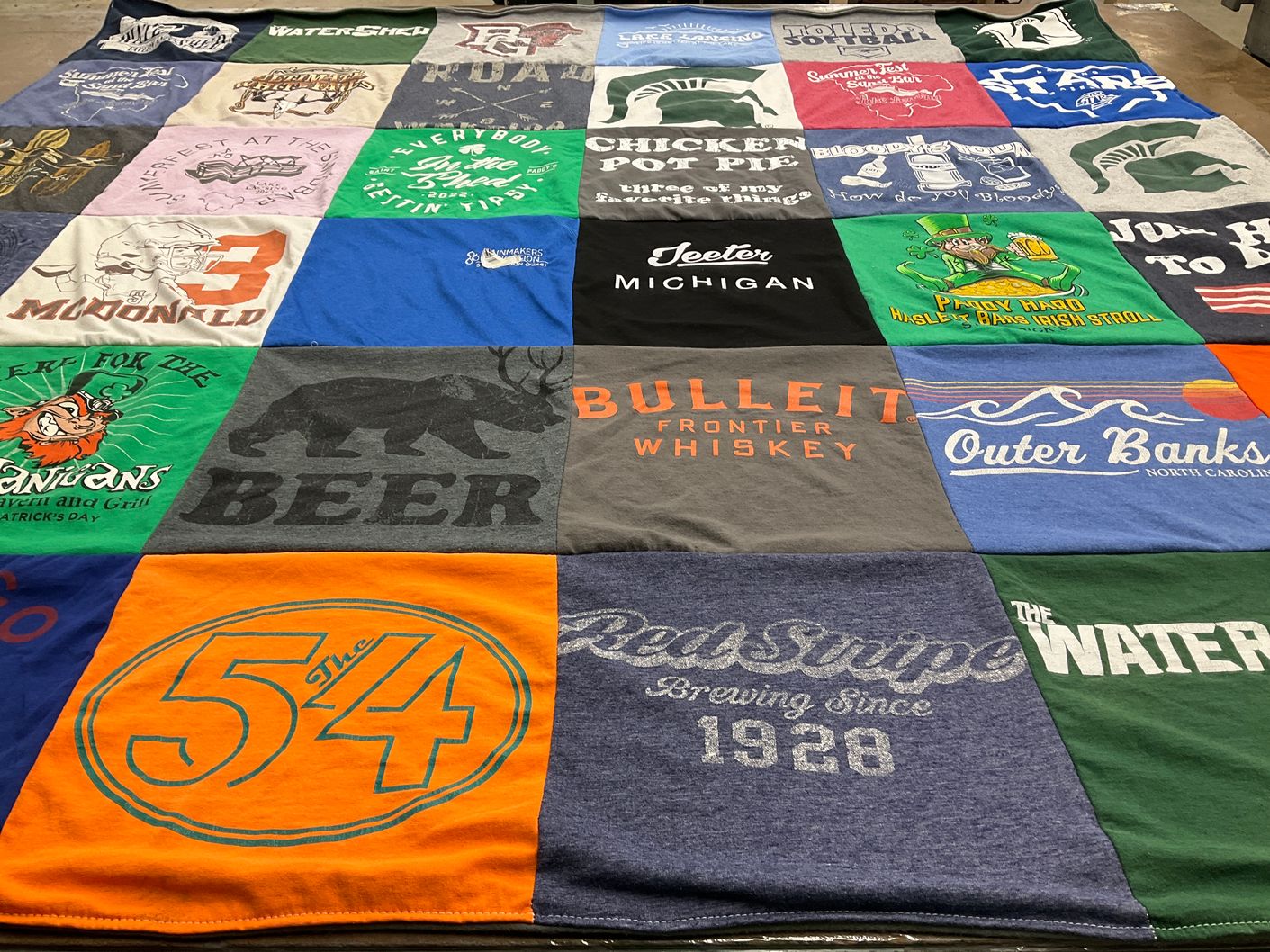 T-shirt quilt with beverages, travel themes by Heather from MI