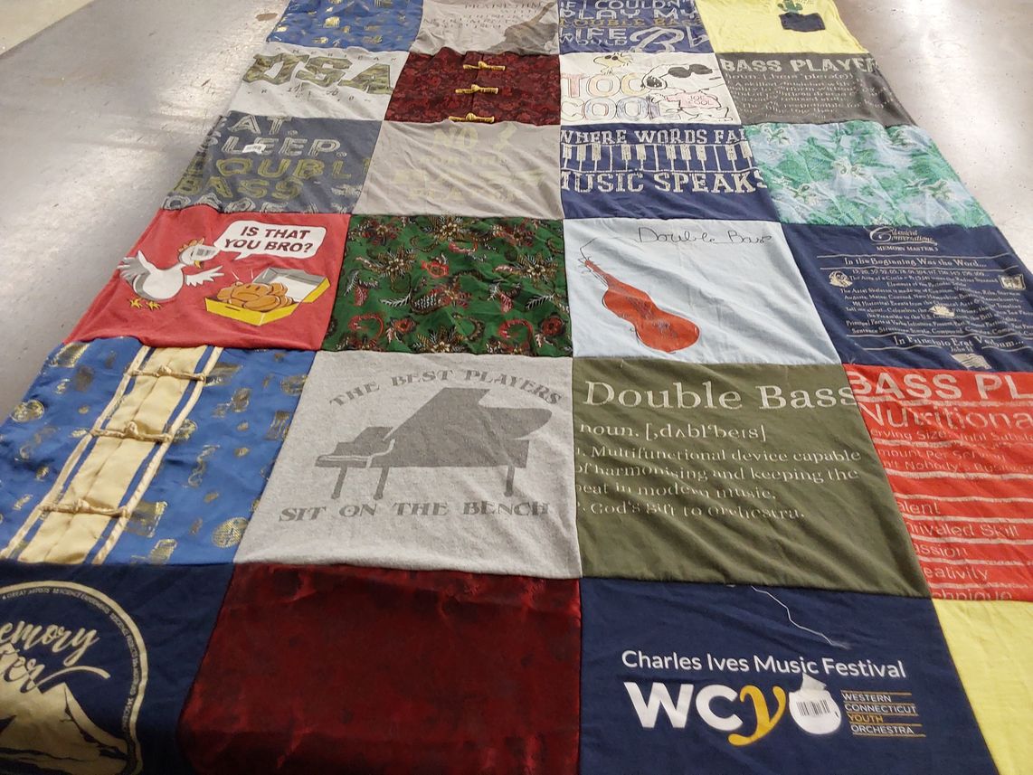 T-shirt quilt with music, bass playing themes by Pamela from CT