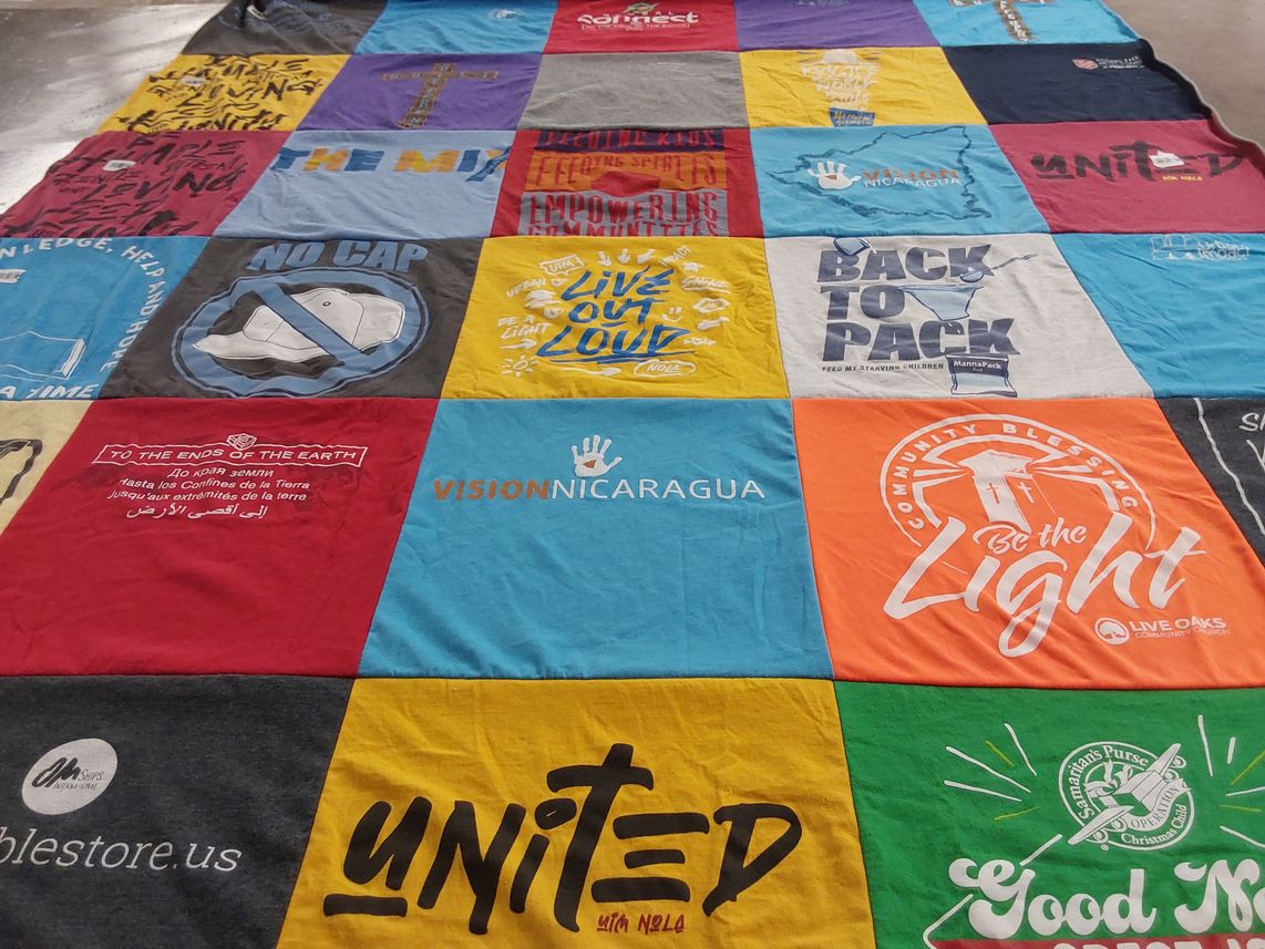 T-shirt quilt with community service, charity themes by Susan from FL