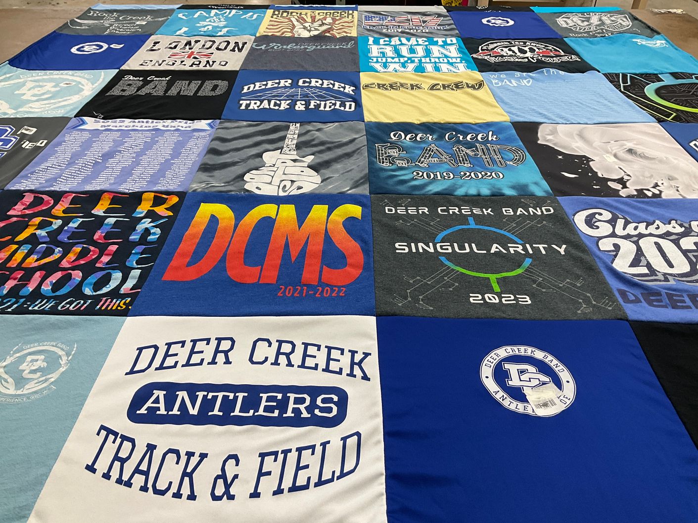 T-shirt quilt featuring deer creek antlers track & field by Tailyn from OK