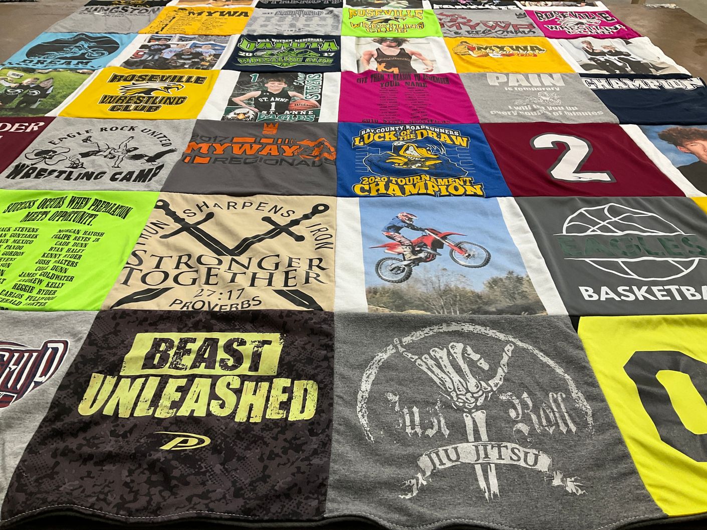 T-shirt quilt with wrestling, basketball themes by Jill from MI