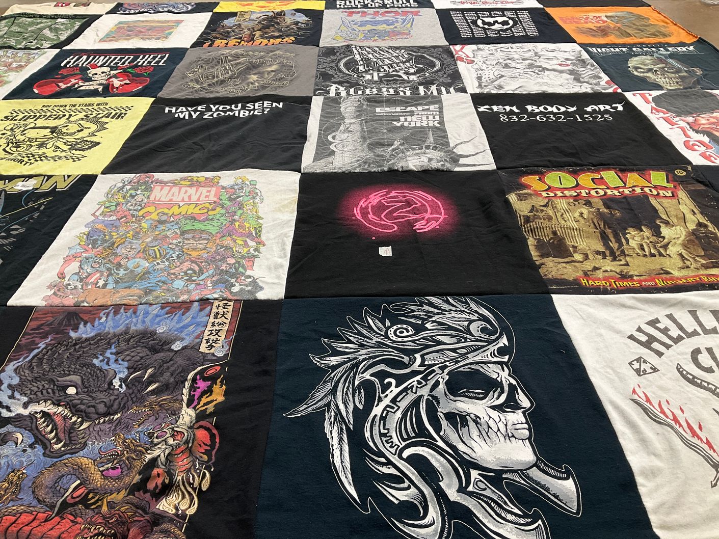 T-shirt quilt with comics, music themes by Margaret from TX