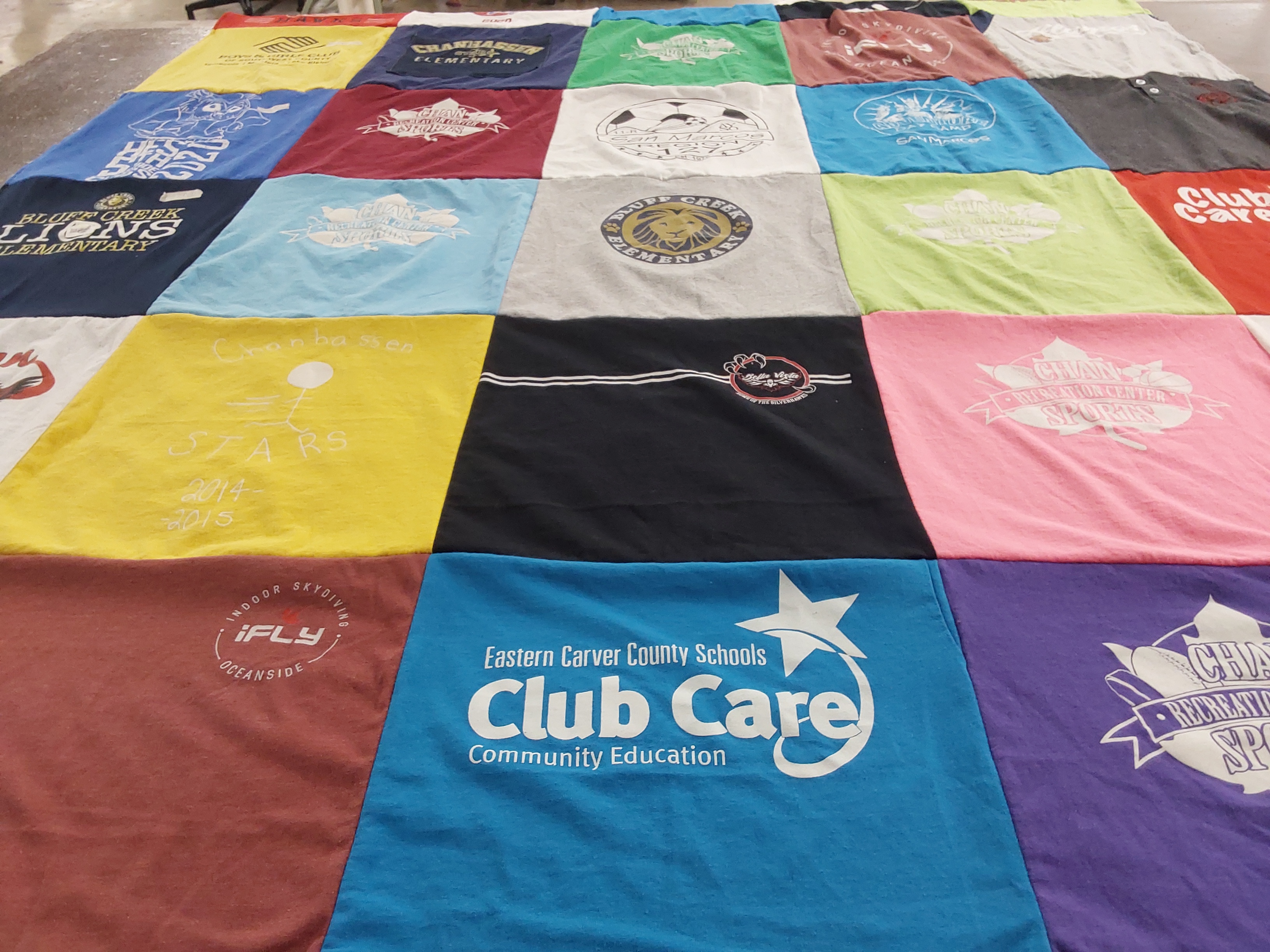 T-shirt quilt with sports, community themes by Robyn from AZ