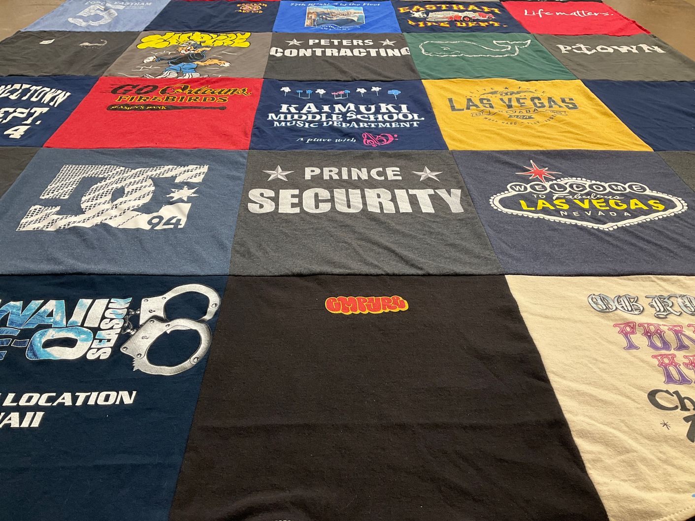 T-shirt quilt featuring peters contracting, firebirds by Violeta from HI