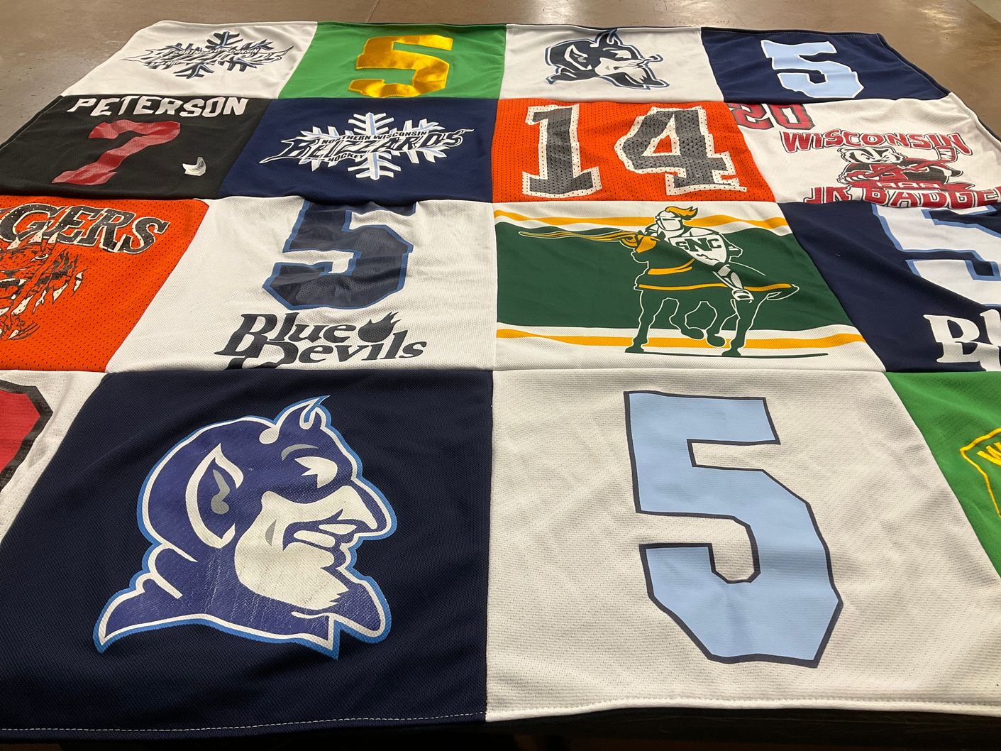 T-shirt quilt featuring university of wisconsin badgers, university of north carolina tar heels by Andrea from WI