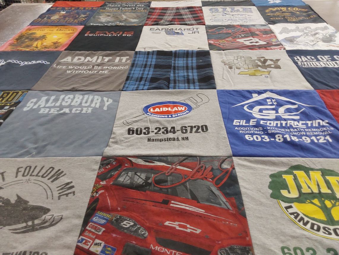 T-shirt quilt with racing, plumbing themes by patricia from NH