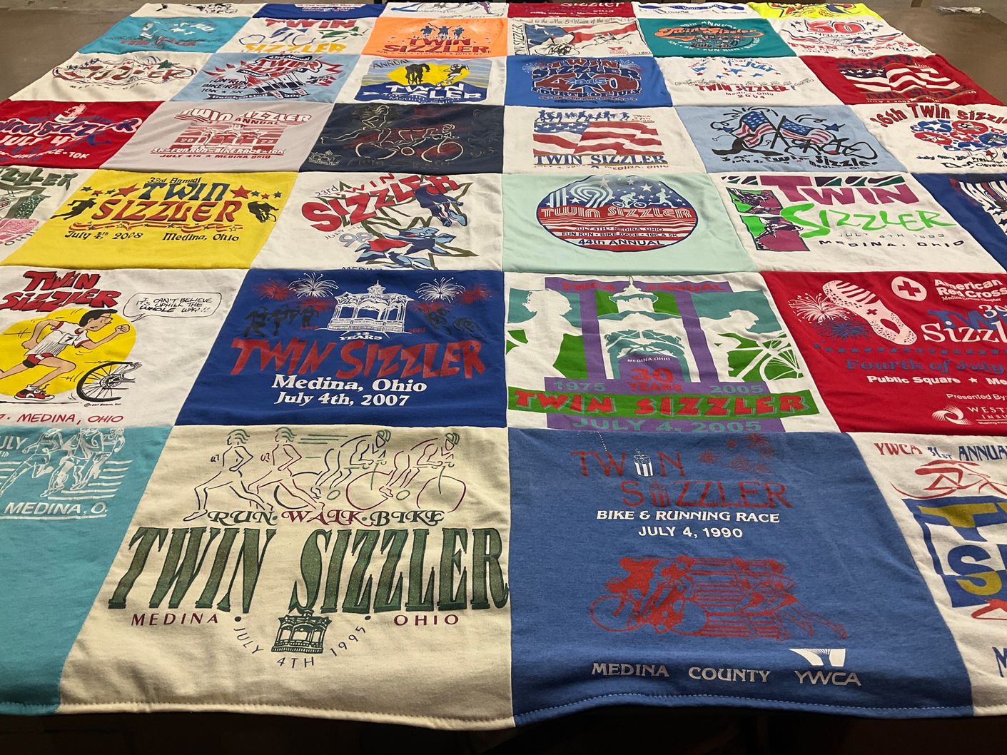 T-shirt quilt with running, biking themes by Laura from OH