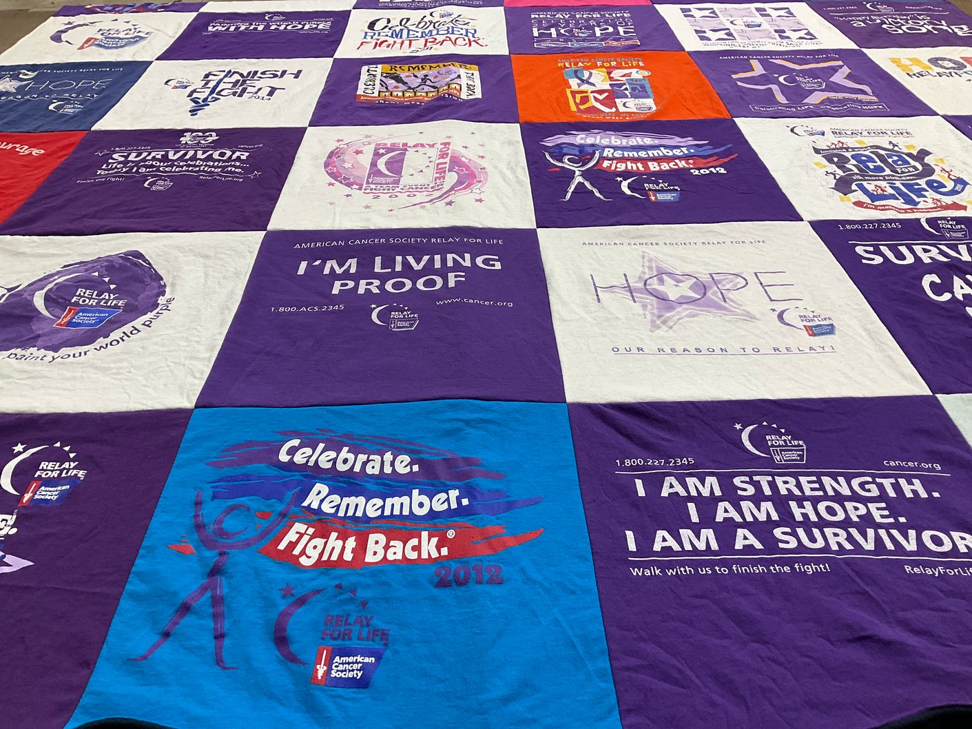 T-shirt quilt with cancer awareness, fundraising themes by Patti from ND