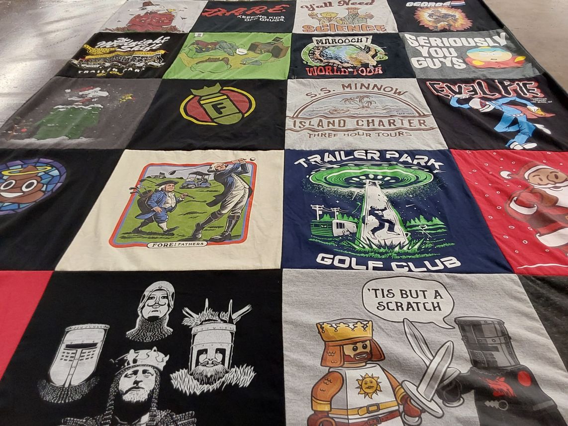 T-shirt quilt with golf, science fiction themes by JP from CA