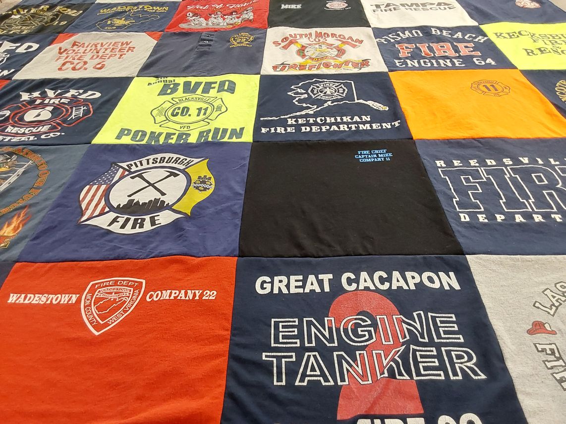 T-shirt quilt with firefighting, community service themes by Jacqueline L from WV