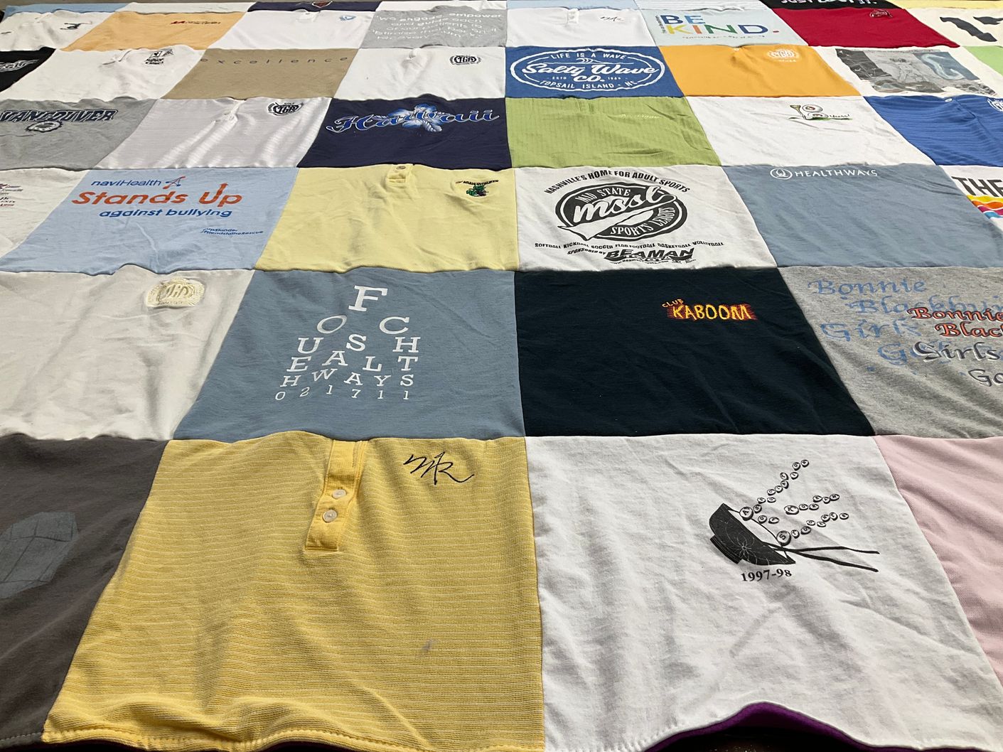 T-shirt quilt with sports, health awareness themes by Thuytien from NC