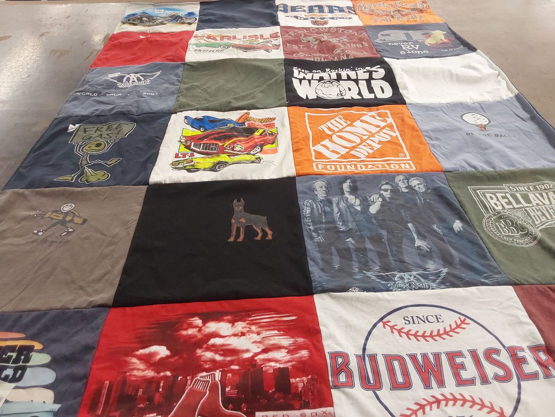 T-shirt quilt with cars, music themes by Lynda from NH