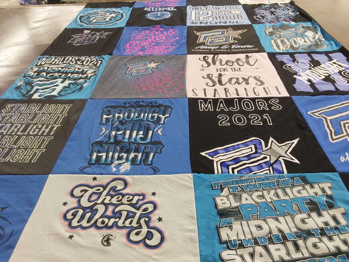 T-shirt quilt with cheerleading, competitions themes by Holly from TX