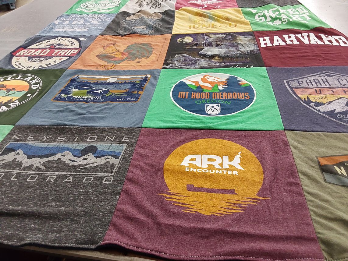 T-shirt quilt with travel, outdoor themes by Katrina from CA