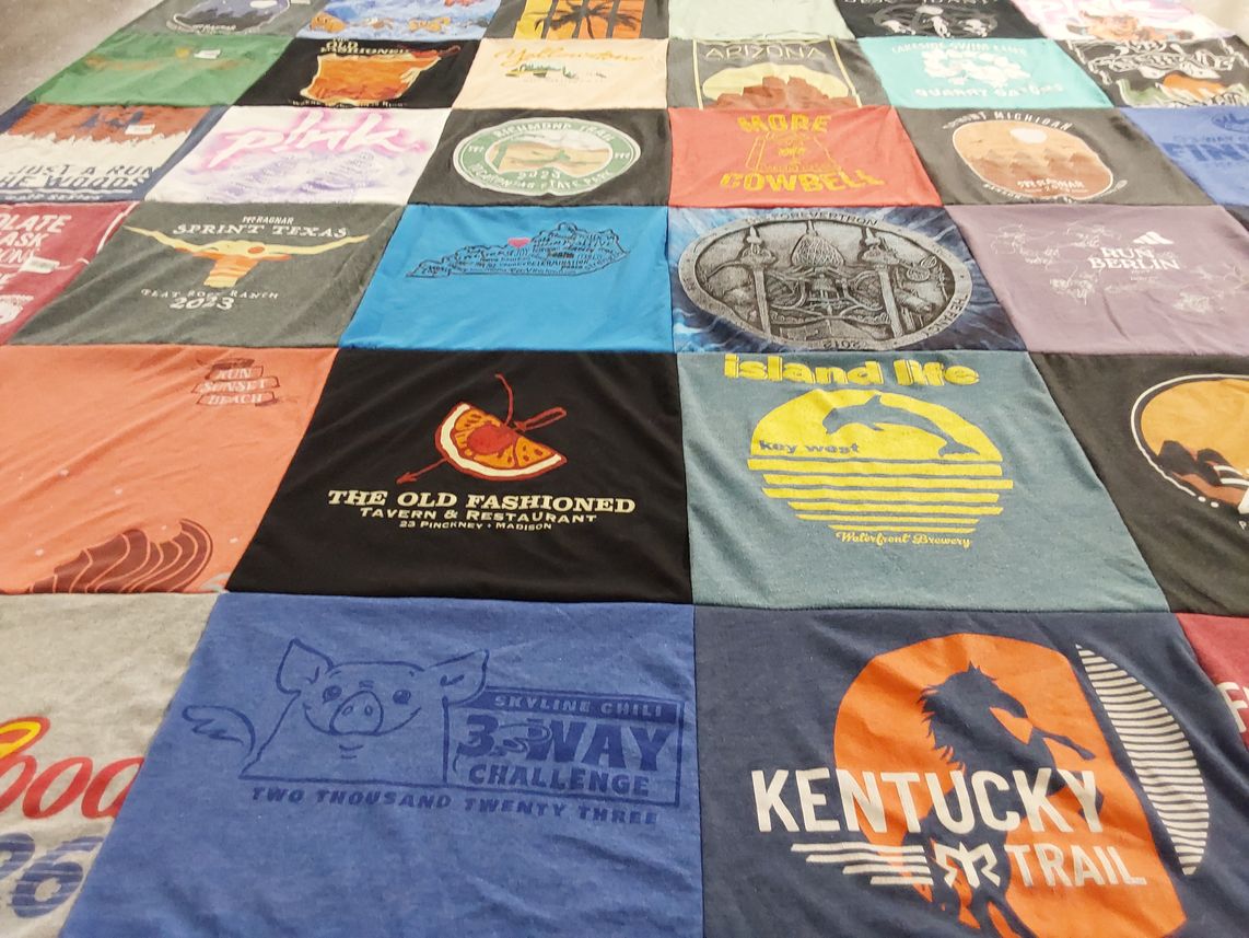 T-shirt quilt with cooking, traveling themes by Julie from KY