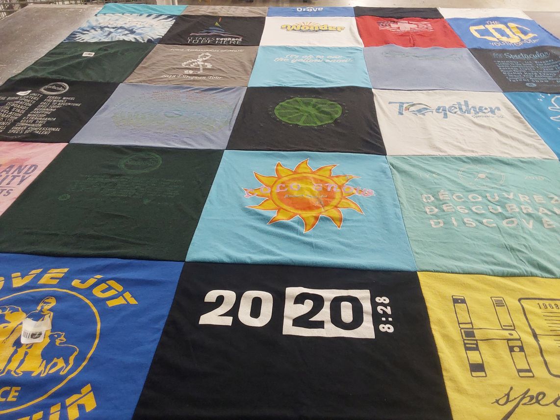 T-shirt quilt with sustainability, community themes by Loralei from IA
