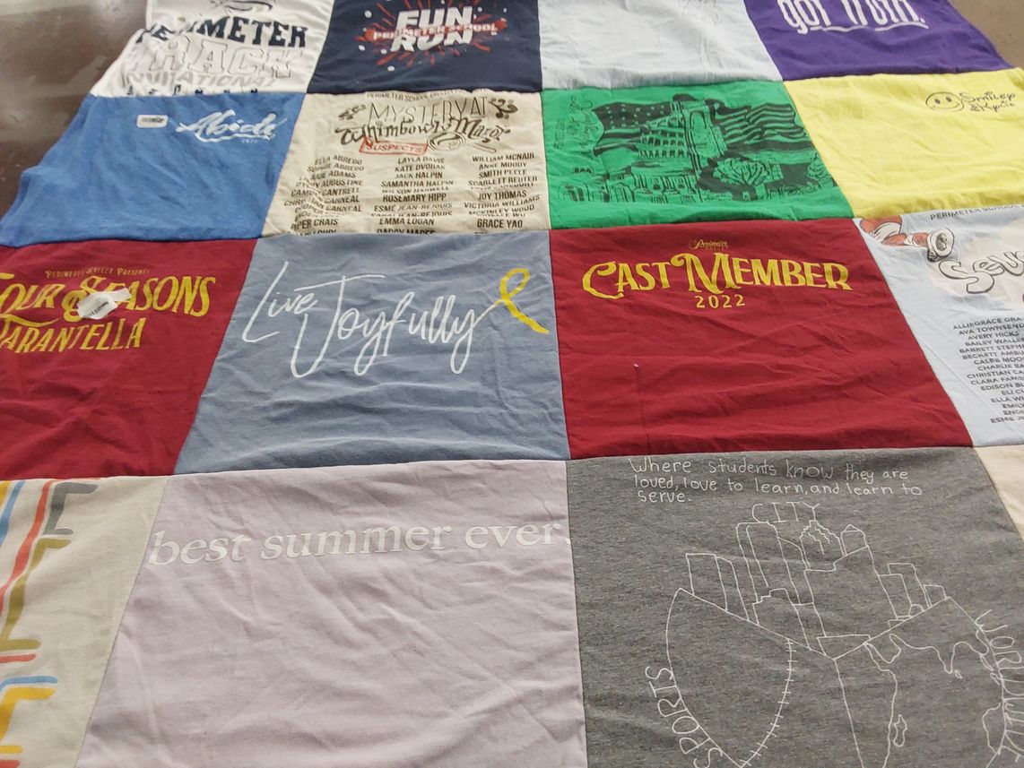 T-shirt quilt with theater, community service themes by Kate from GA